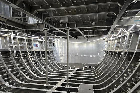 The bare aluminium hull framing of a yacht under construction